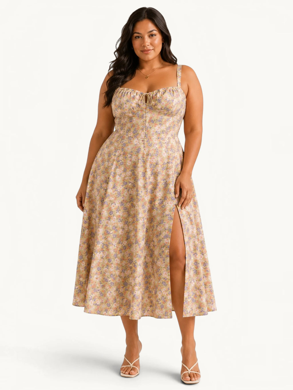 Robe midi fleurie grande taille pour femme avec corsage style corset, fines bretelles, fente latérale et imprimé floral pastel, conçue pour sublimer les courbes avec une coupe élégante, confortable et idéale pour les cérémonies, garden-parties et événements estivaux.