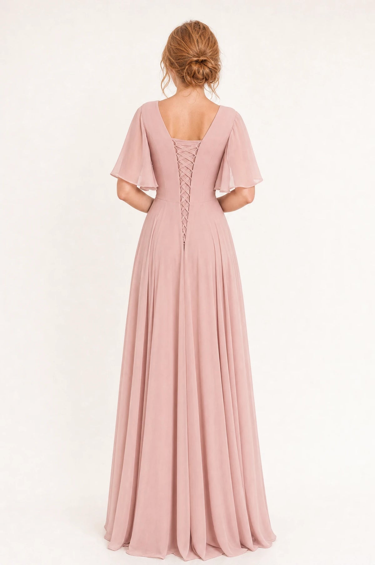 Dos de la robe demoiselle d'honneur mousseline rose blush Rosalie portée par Julie, encolure dos carrée, laçage croisé ajustable, manches papillon, jupe évasée en mousseline