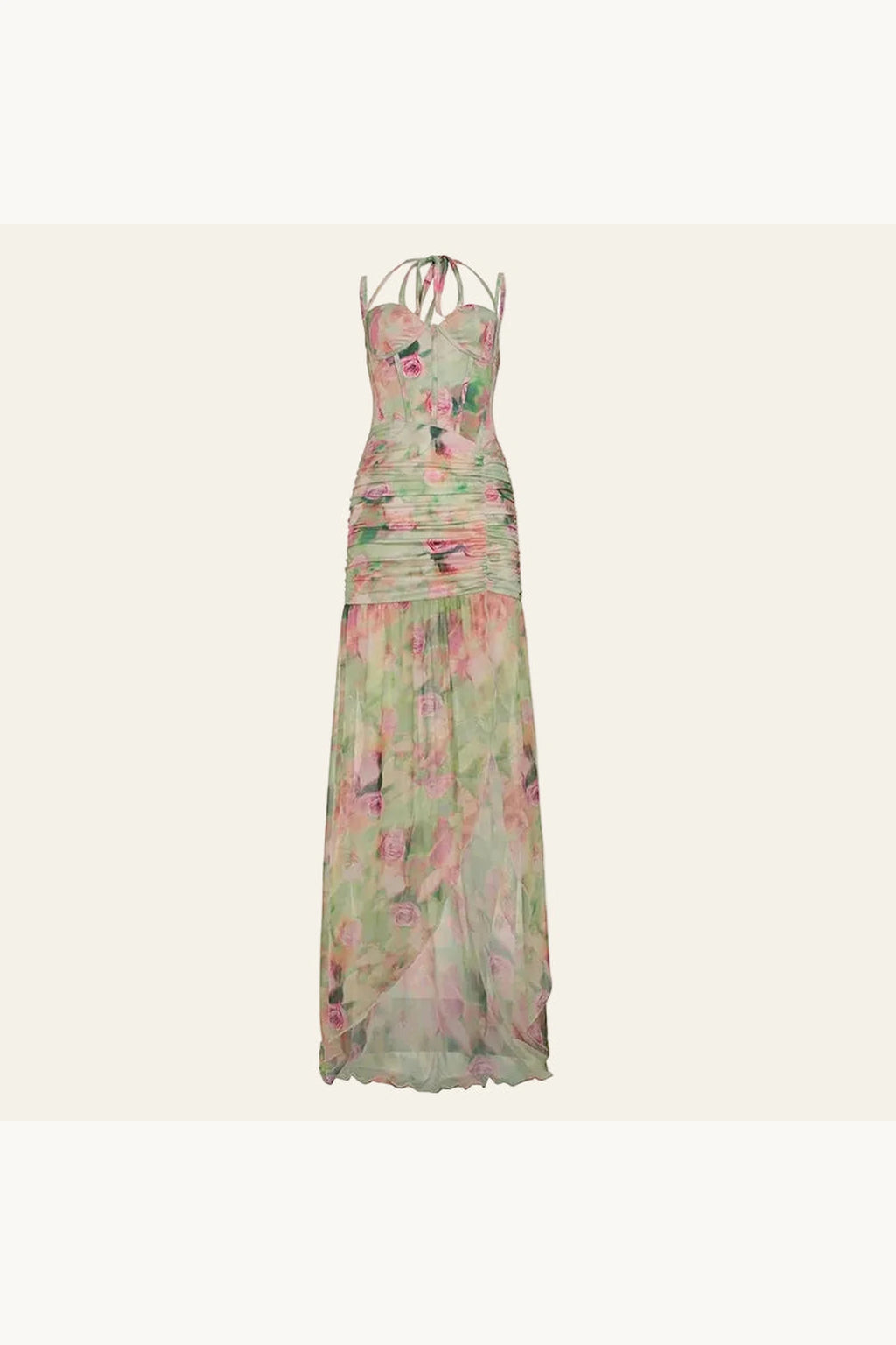 Robe fendue longue très séduisante. La robe est présenté sur un fond beige. Les motifs floraux ressemble à de l'aquarelle aux couleurs pastels rose et vert. Le tissu très léger joue avec la transparence pour une allure élégante et sexy.