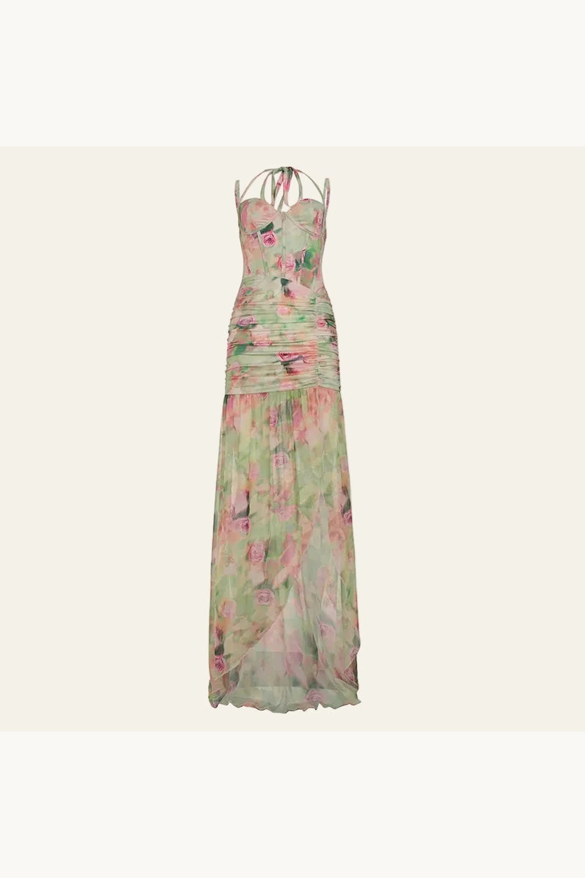 Robe fendue longue très séduisante. La robe est présenté sur un fond beige. Les motifs floraux ressemble à de l'aquarelle aux couleurs pastels rose et vert. Le tissu très léger joue avec la transparence pour une allure élégante et sexy.